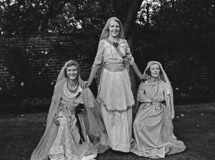 Framed Print : Three women wearing fancy dress in a garden Framed Print : Three women wearing fancy dress in a garden