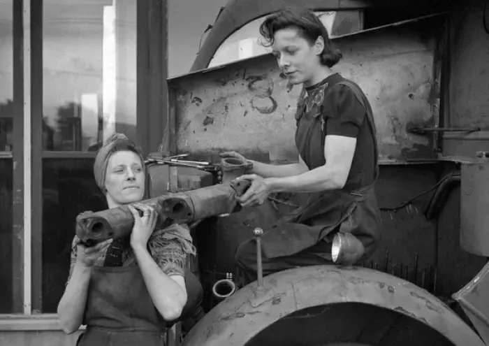 Framed Print : Two women working in a garage Framed Print : Two women working in a garage