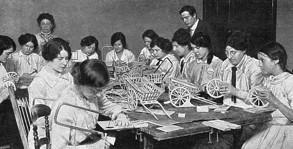 Womens Emergency Corps making toys, WW1