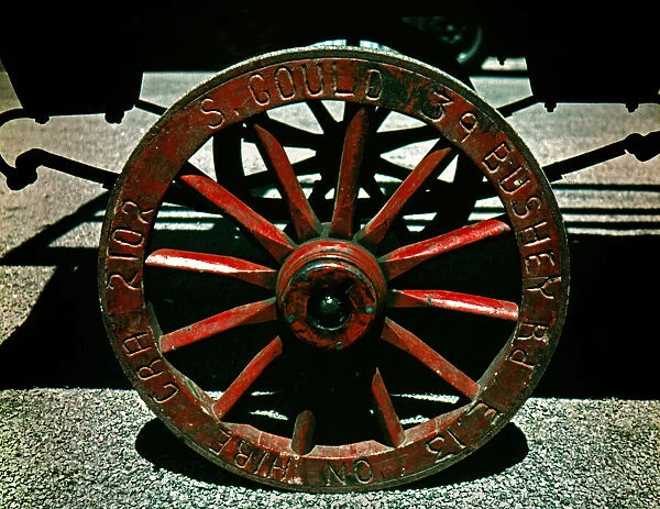Wooden spoked wheel on market barrow, London