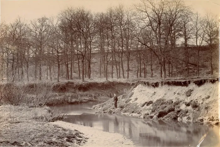 Framed Print : Woolfe family of The Clough, Hale, Bucklow, Cheshire - boy standing by the River Bollin, with bare trees in the background. Date: circa 1889 Framed Print : Woolfe family of The Clough, Hale, Bucklow, Cheshire - boy standing by the River Bollin, with bare trees in the background. Date: circa 1889