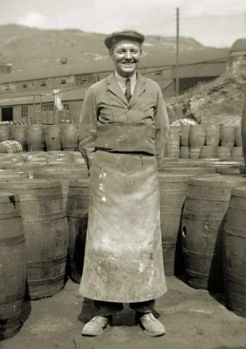Framed Print : Workman in apron with barrels Framed Print : Workman in apron with barrels