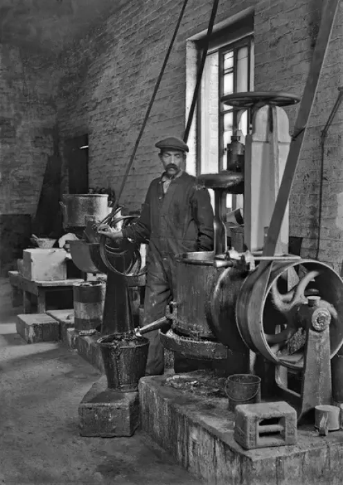 Framed Print : Workman in a factory operating machinery - lead works Framed Print : Workman in a factory operating machinery - lead works