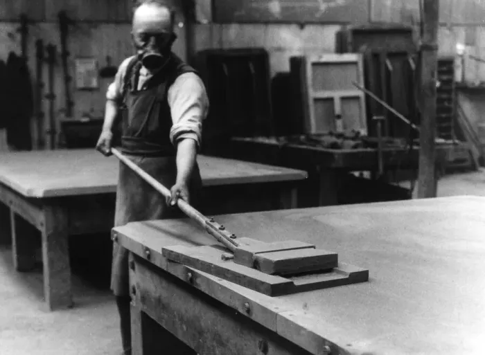Framed Print : A workman smoothing the surface of the slate bed of a billiard table at a factory in Framed Print : A workman smoothing the surface of the slate bed of a billiard table at a factory in
