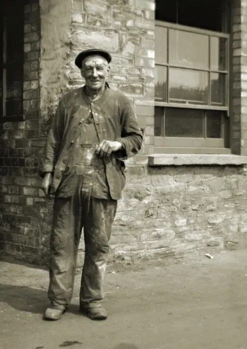 Framed Print : Workman standing outside a building Framed Print : Workman standing outside a building