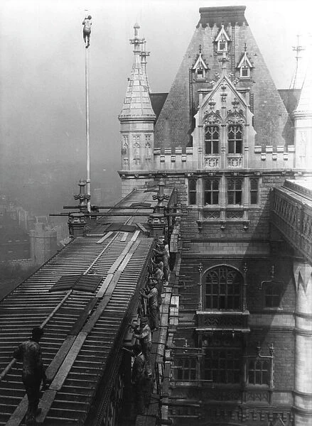 Workmen repairing part of the walkways on Tower Bridge