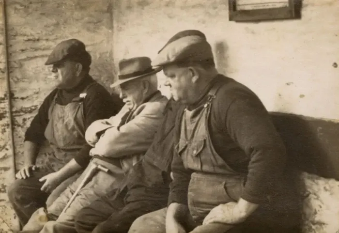 Framed Print : Four workmen sitting on a bench Framed Print : Four workmen sitting on a bench