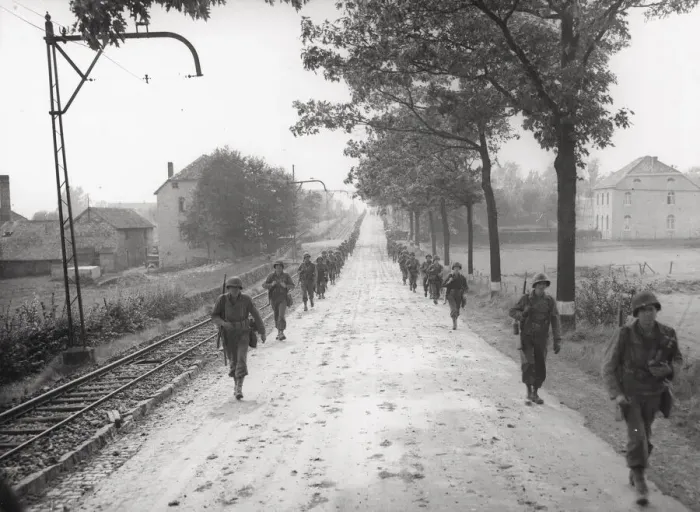 Framed Print : WW II 1st US Army marching on the road to Aachen, Germany Framed Print : WW II 1st US Army marching on the road to Aachen, Germany