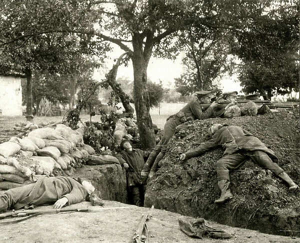 WW1 - British soldiers firing from a captured German trench