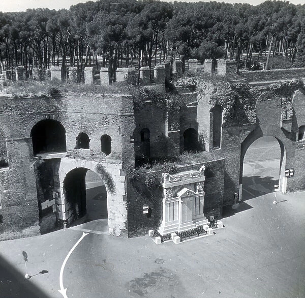 WW1 memorial set against ancient wall, Rome