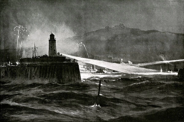WW1 - A scene of Dover at night as its searchlights discover two German