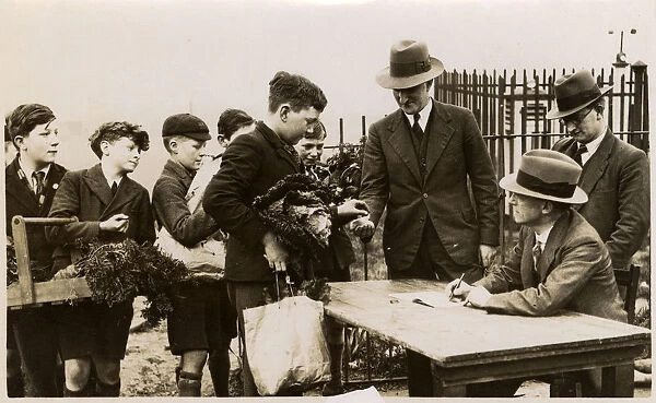 WW2 - English schoolboys buy vegetables from school garden