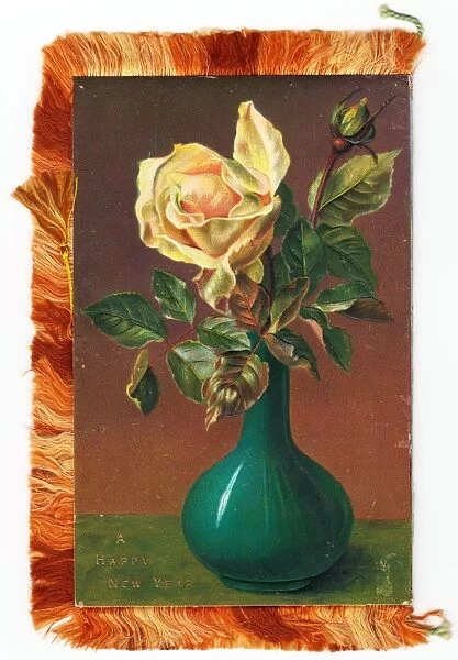 Yellow rose on a New Year card with fringe
