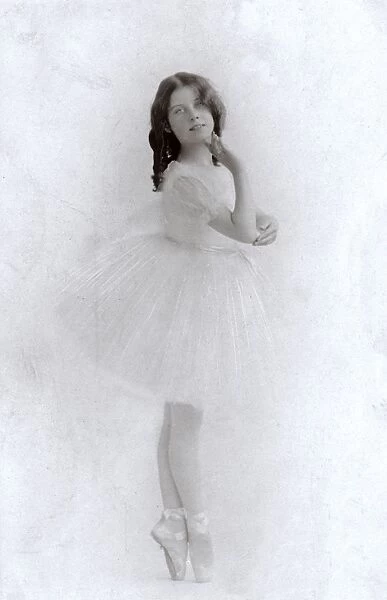 Young ballerina in a studio photo