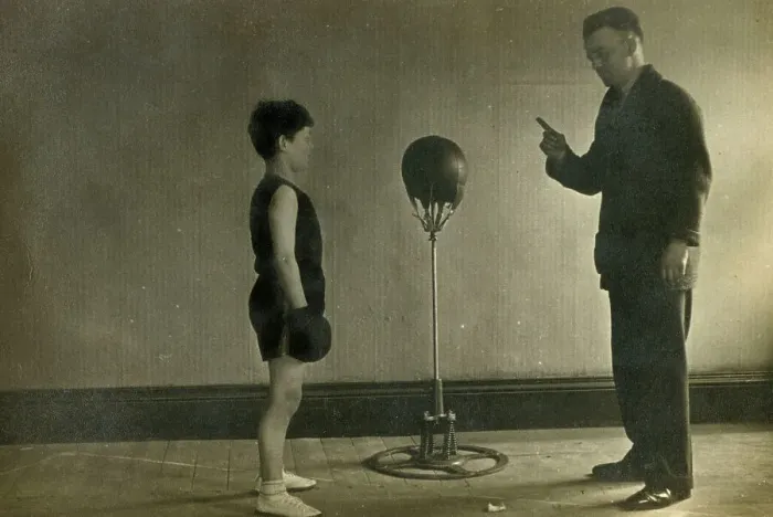 Framed Print : Young Boxer receiving instruction from his Trainer in a gym Framed Print : Young Boxer receiving instruction from his Trainer in a gym