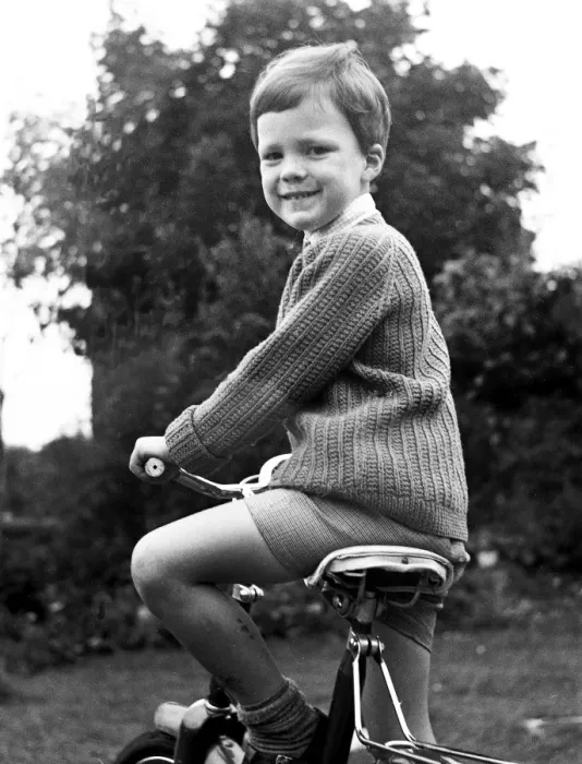 Framed Print : Young Boy on his bicycle, smiling Framed Print : Young Boy on his bicycle, smiling