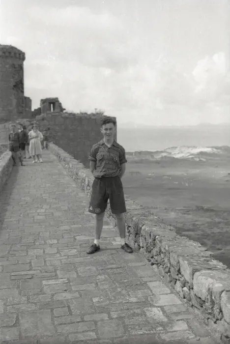 Framed Print : Young boy standing on the ramparts of Harlech Castle Framed Print : Young boy standing on the ramparts of Harlech Castle