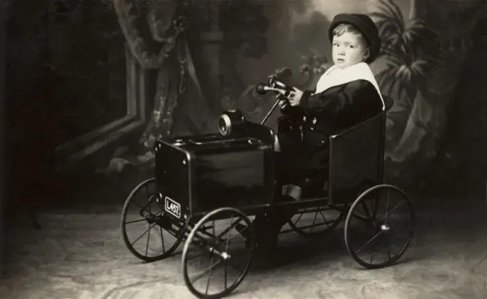 Framed Print : Young boy in toy car Framed Print : Young boy in toy car