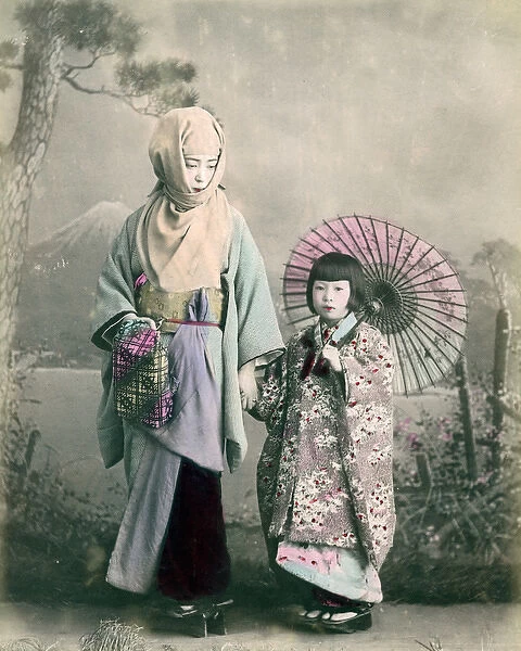 Young child with mother  /  nurse and parasol, Japan, circa 1890