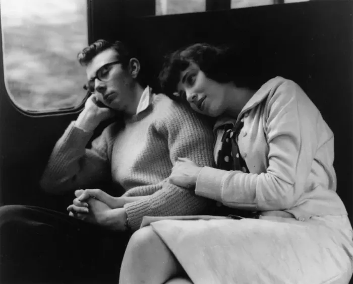 Framed Print : Young couple relaxing in a train compartment Framed Print : Young couple relaxing in a train compartment