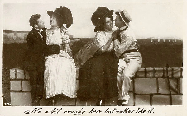 Two young couples sharing a seaside cuddle