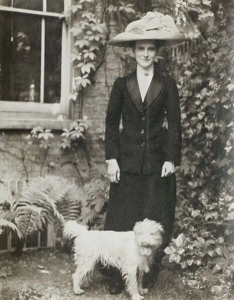 Young Edwardian woman with a dog