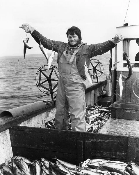 Young fisherman handline fishing for mackerel