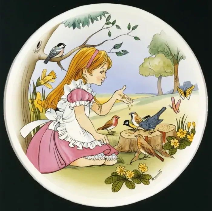 Framed Print : A young girl feeds the birds Framed Print : A young girl feeds the birds