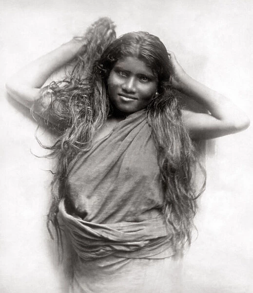 Young girl with long hair, India, c. 1890