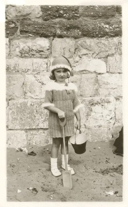 Framed Print : Young girl in remarkable woollen ensemble on beach Framed Print : Young girl in remarkable woollen ensemble on beach