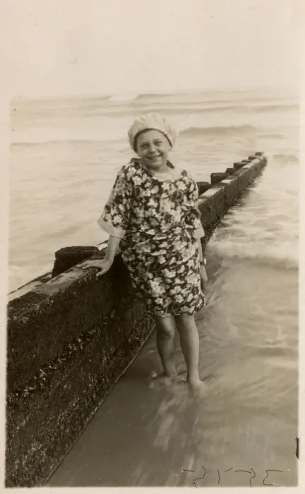 Framed Print : Young girl at the seaside in floral dress and bathing cap Framed Print : Young girl at the seaside in floral dress and bathing cap