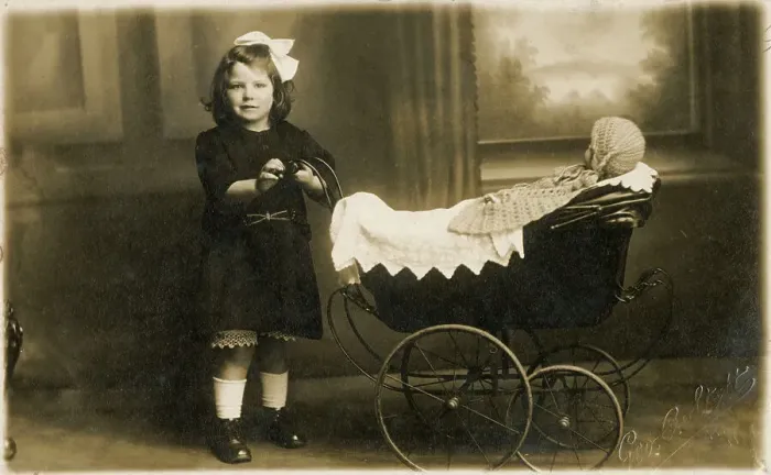 Framed Print : Young girl taking her dolly out in a fine perambulator Framed Print : Young girl taking her dolly out in a fine perambulator