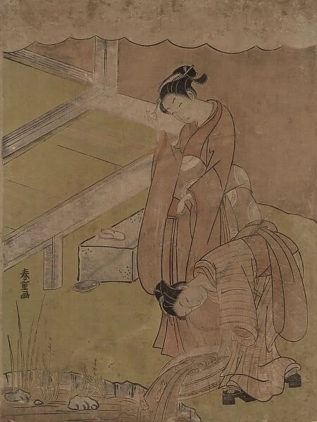 Young girl throwing goldfish into a pond