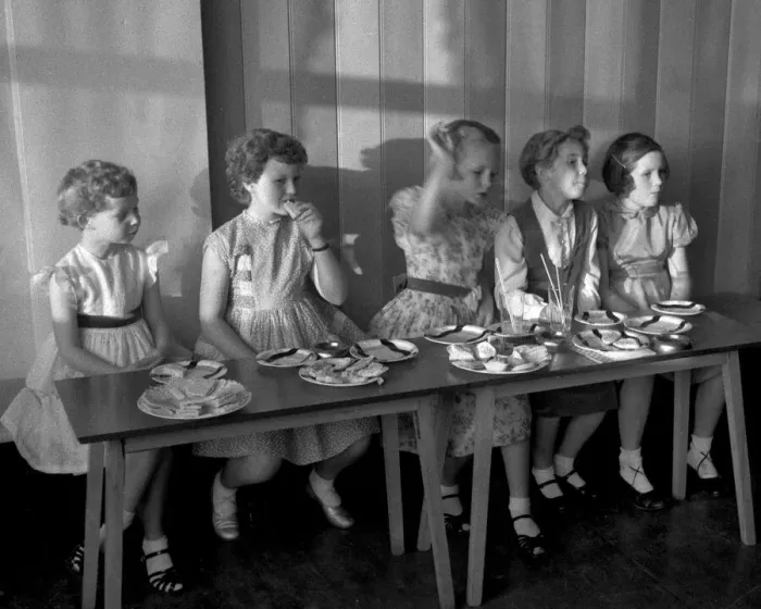 Framed Print : Young girls enjoying food at a party Framed Print : Young girls enjoying food at a party