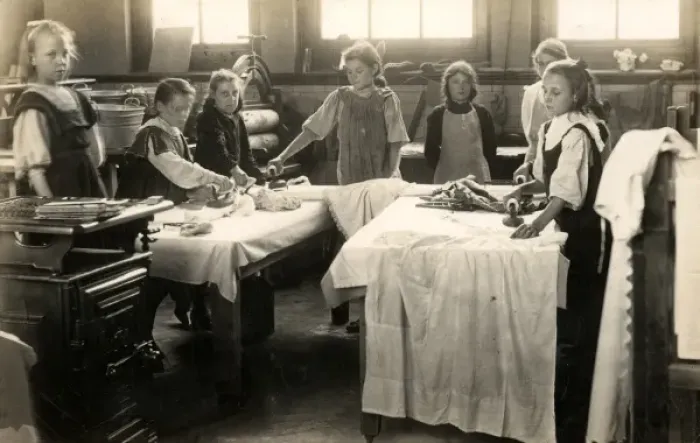 Framed Print : Young girls ironing in laundry room, Surrey Framed Print : Young girls ironing in laundry room, Surrey