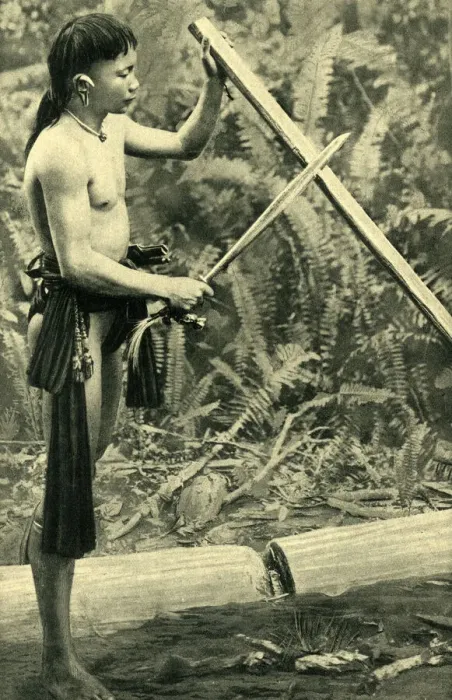 Framed Print : Young Kayan man making a blowpipe, Borneo, SE Asia Framed Print : Young Kayan man making a blowpipe, Borneo, SE Asia