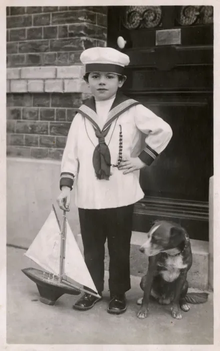 Framed Print : Young lad in sailor suit with pet dog and model ship