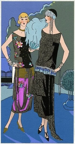 Two young ladies in evening dresses by Redfern