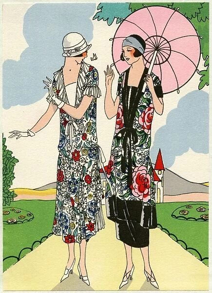 Two young ladies in outfits by Doeuillet