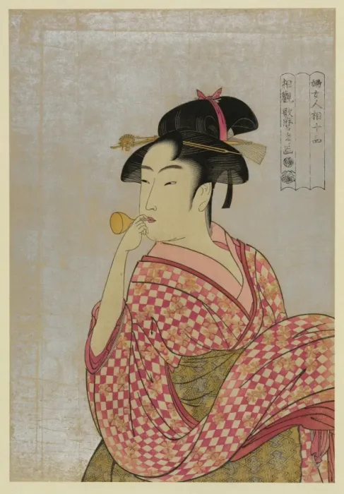 Framed Print : Young lady blowing on a poppin Framed Print : Young lady blowing on a poppin