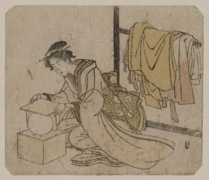Framed Print : Young lady removing a kemari (ball) from its box Framed Print : Young lady removing a kemari (ball) from its box