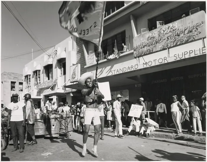 Framed Print : A young man in shorts dances and waves a flag about at the Port of Spain Carnival, Trinidad, West Indies. Date: 1968 Framed Print : A young man in shorts dances and waves a flag about at the Port of Spain Carnival, Trinidad, West Indies. Date: 1968
