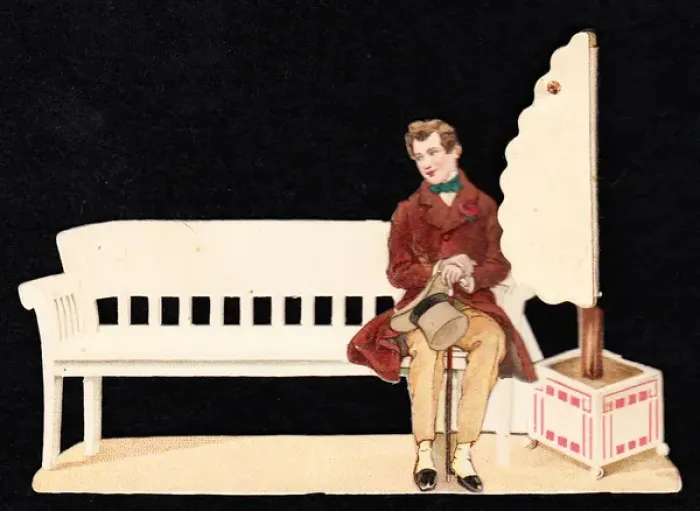 Framed Print : Young man sitting on a bench on a greetings card Framed Print : Young man sitting on a bench on a greetings card