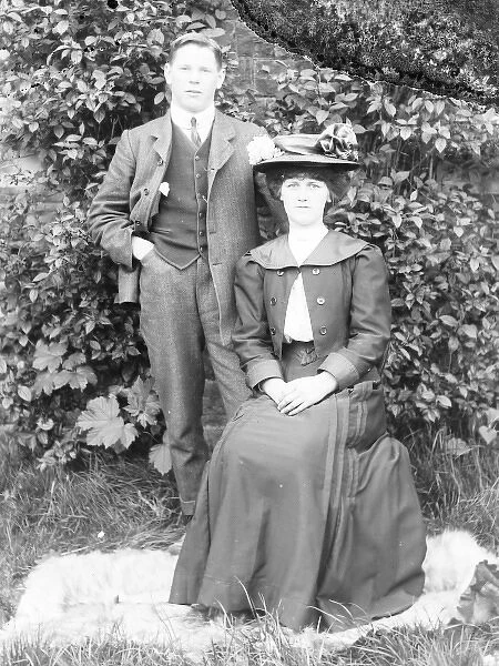 Young married couple in a garden, Mid Wales