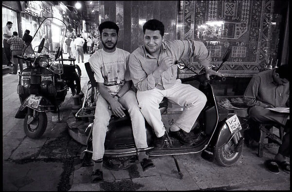 Young men with scooter outside Bazaar, Cairo, Egypt. Date: 1980s