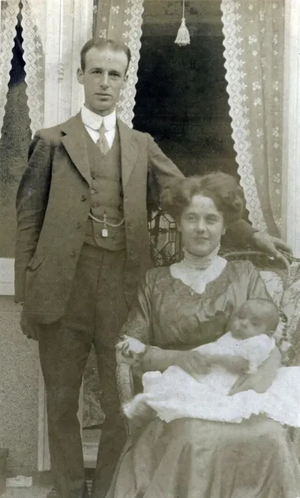 Framed Print : A young middle class couple pose for a photograph with their new little baby Framed Print : A young middle class couple pose for a photograph with their new little baby