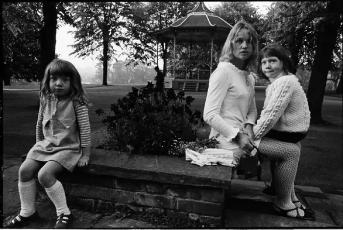 Framed Print : Young mother in a park with children bandstand and cyclist Framed Print : Young mother in a park with children bandstand and cyclist