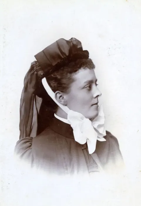 Framed Print : Young nurse with bonnet tied on with fancy white ribbon Framed Print : Young nurse with bonnet tied on with fancy white ribbon
