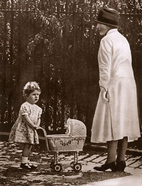 Young Princess Elizabeth with her first toy pram