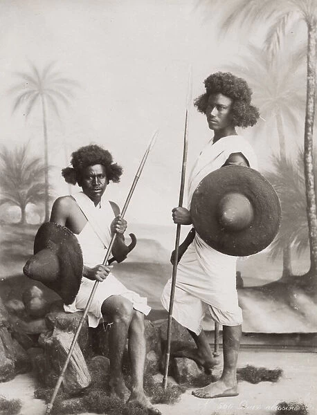Two young warriors, swords, north east Africa